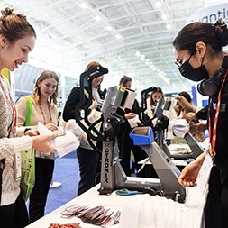 pressing hats at a convention